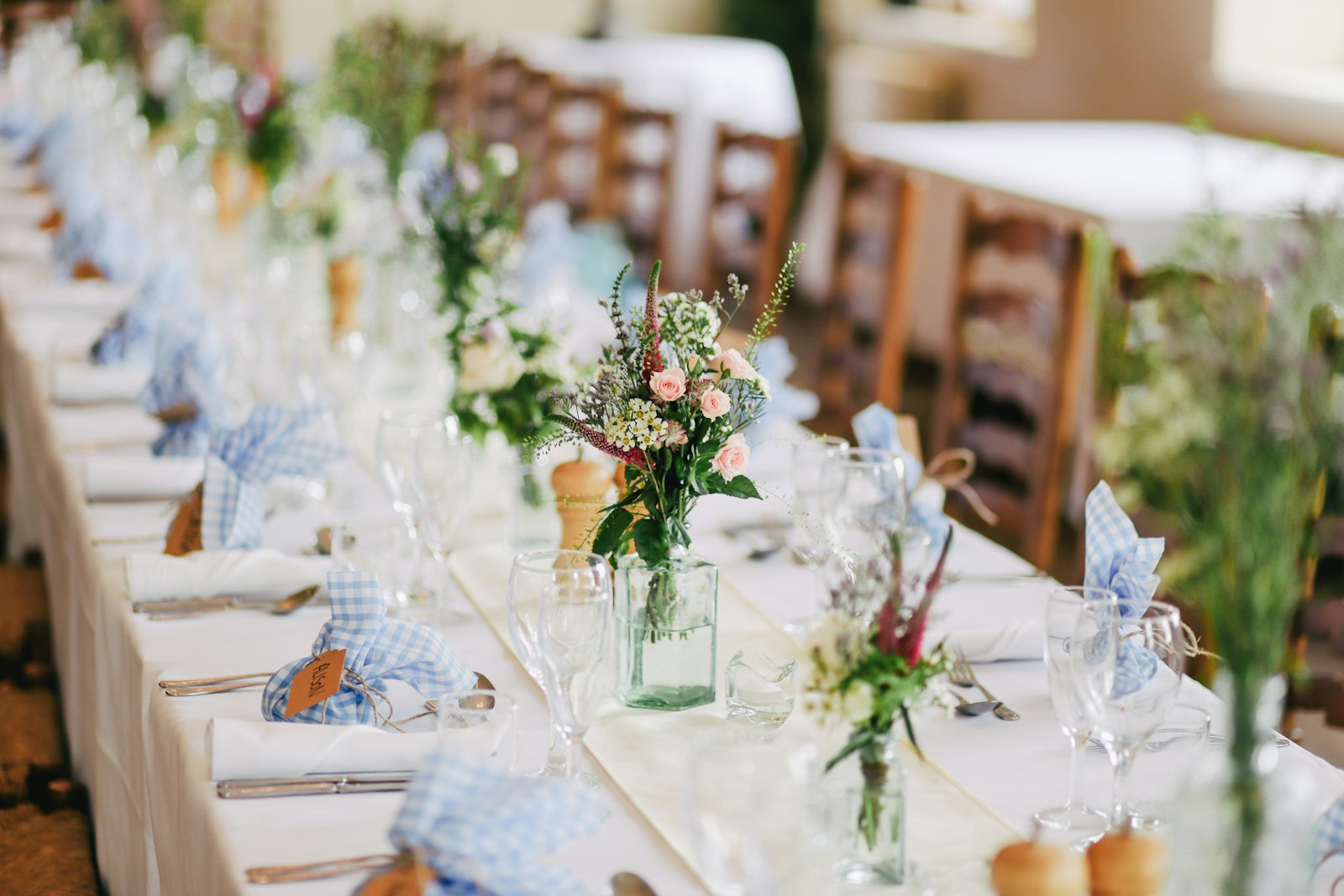 Elegant outdoor destination wedding ceremony seating with white florals