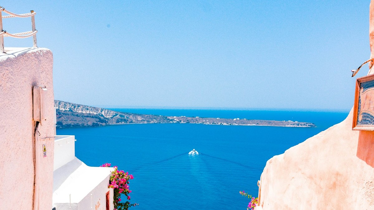 Whitewashed steps and blue Aegean views for planning a Greece island-hopping or resort-base trip