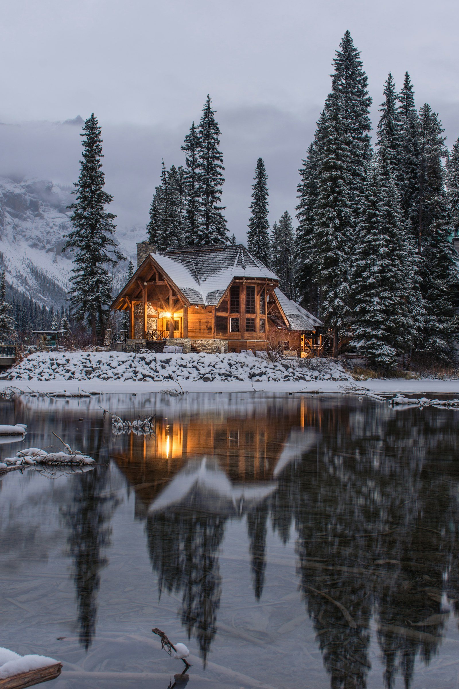 Snow-covered alpine village and mountains for luxury winter chalet planning