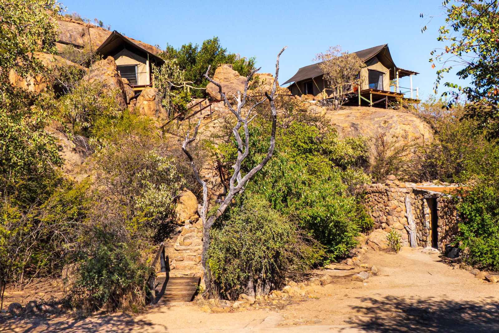 Secluded safari lodges in a desert landscape for luxury family safari planning