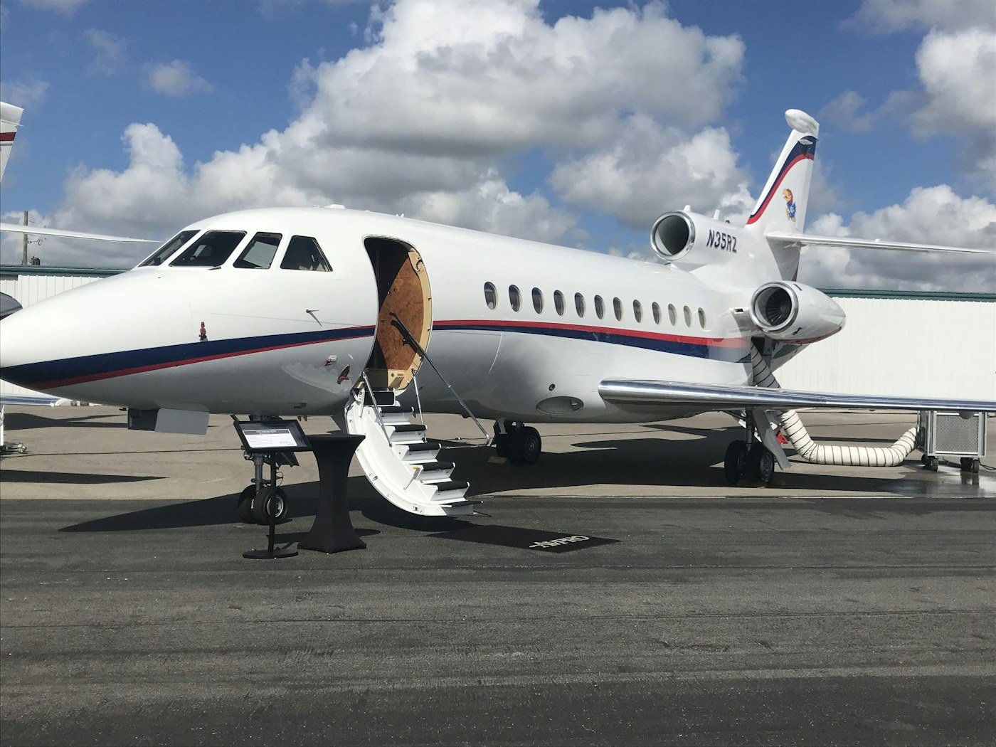 Private jet parked on an airport apron at golden hour