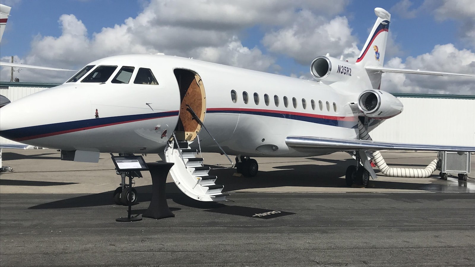 Private jet parked at sunset for multi-stop luxury travel planning