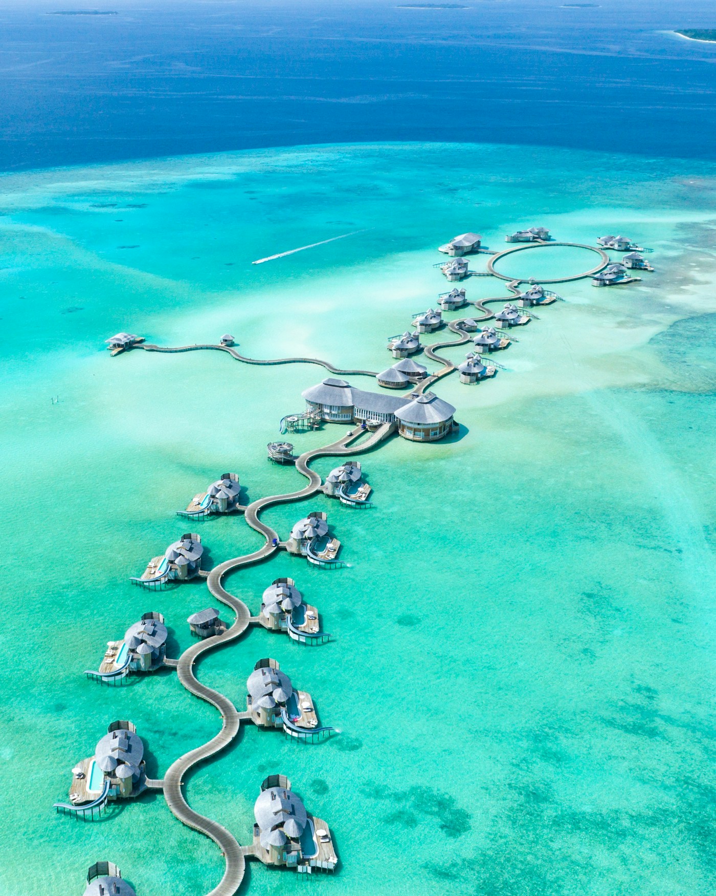 Overwater villas in a turquoise Maldives lagoon
